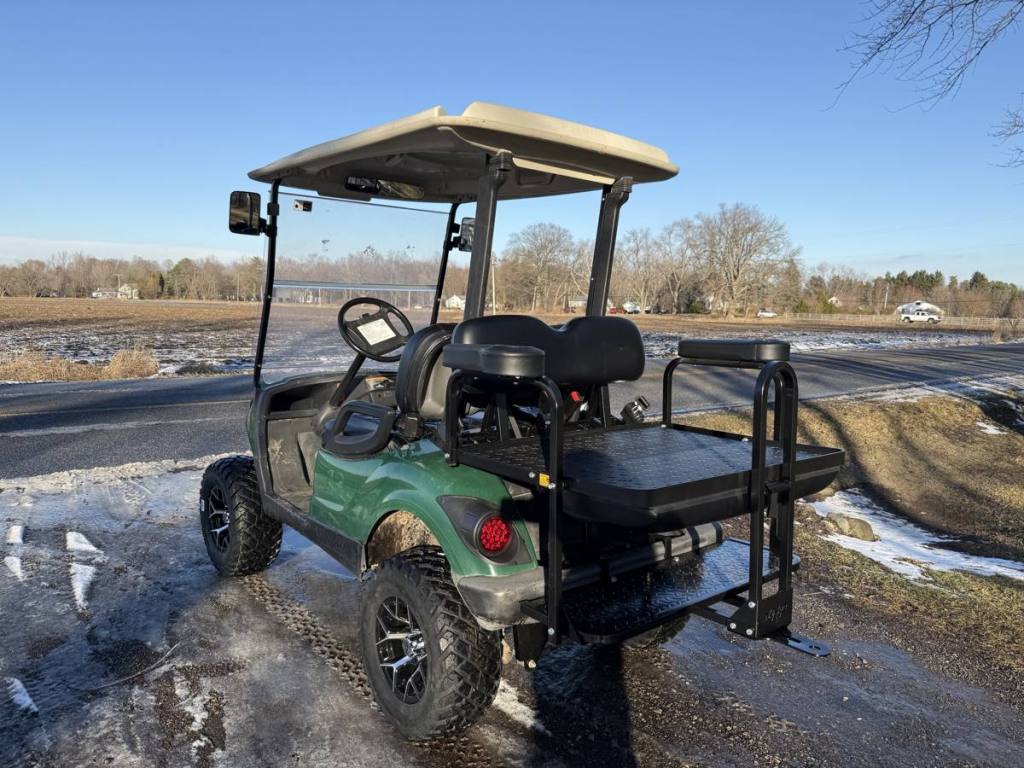 Lifted green 2009 Yamaha G29 Drive golf cart sold by Rugged Buggies, Byron, MI