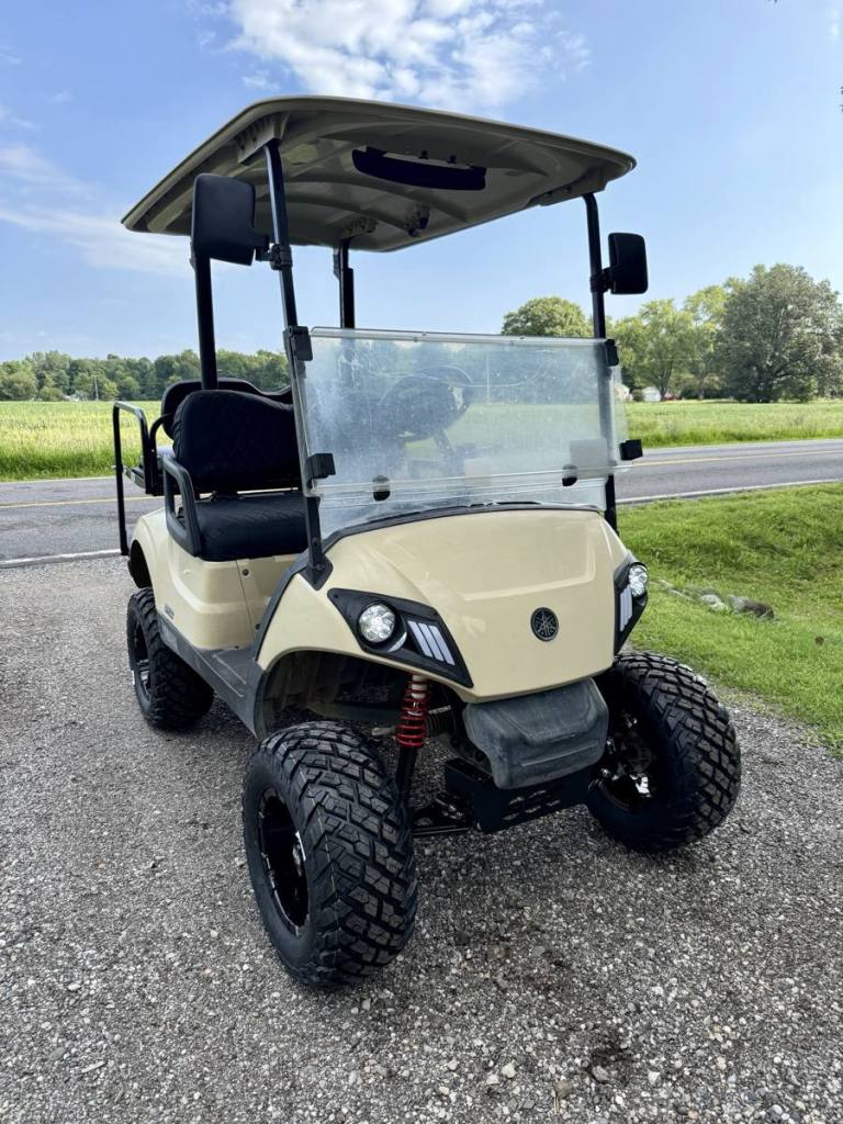 Lifted tan 2020 Yamaha Drive2 EFI golf cart sold by Rugged Buggies, Byron, MI
