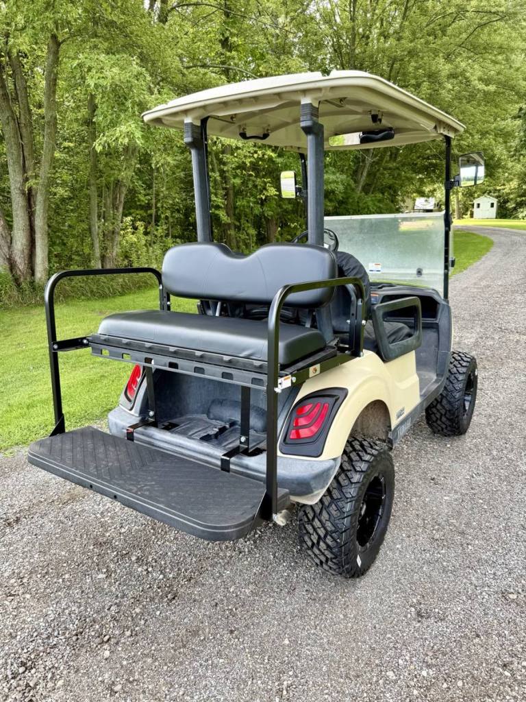 Lifted tan 2020 Yamaha Drive2 EFI golf cart sold by Rugged Buggies, Byron, MI