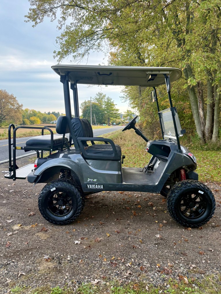 Lifted carbon 2021 Yamaha Drive2 EFI golf cart for sale in Byron, MI