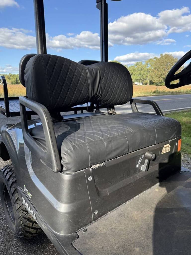 Lifted carbon 2021 Yamaha Drive2 EFI golf cart sold by Rugged Buggies, Byron, MI
