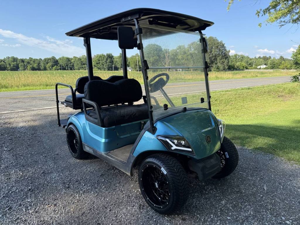 Golf cart with windshield, mirrors, canopy roof and seat covers